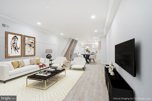 1143 Tasker St, Philadelphia, PA 19148 - living room with recessed lighting, stairway, wood finished floors, visible vents, and ornamental molding