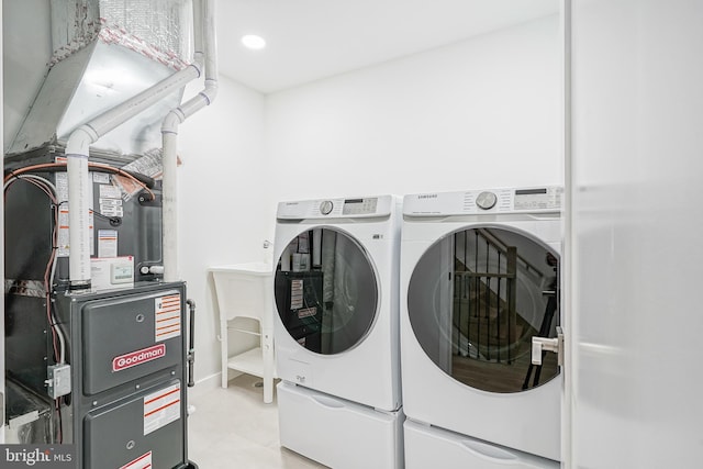 1143 Tasker St, Philadelphia, PA 19148 - laundry room with washing machine and clothes dryer, heating unit, laundry area, and recessed lighting