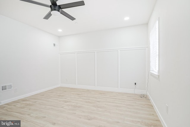1143 Tasker St, Philadelphia, PA 19148 - unfurnished room featuring a ceiling fan, visible vents, light wood-style floors, and a decorative wall