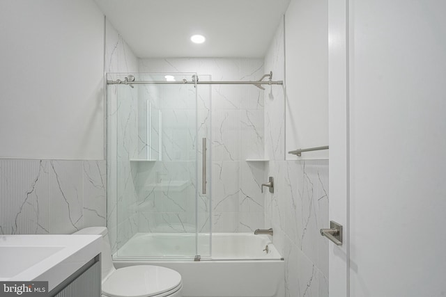 1143 Tasker St, Philadelphia, PA 19148 - full bathroom featuring tile walls, vanity, enclosed tub / shower combo, and toilet