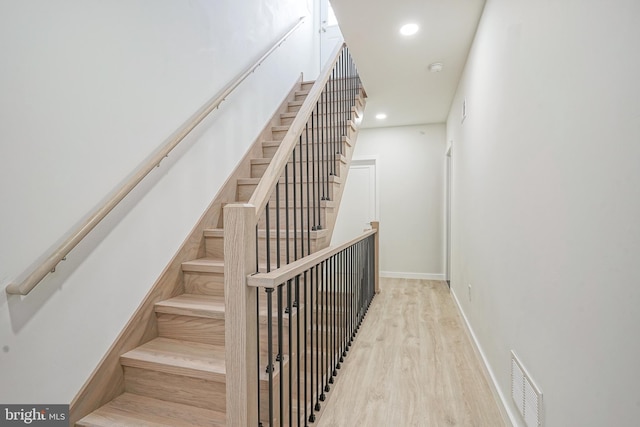 1143 Tasker St, Philadelphia, PA 19148 - stairs featuring recessed lighting, wood finished floors, visible vents, and baseboards