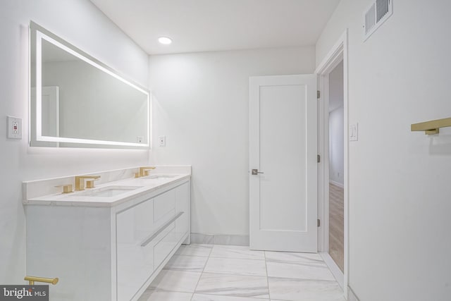 1143 Tasker St, Philadelphia, PA 19148 - full bath featuring visible vents, a sink, marble finish floor, and double vanity