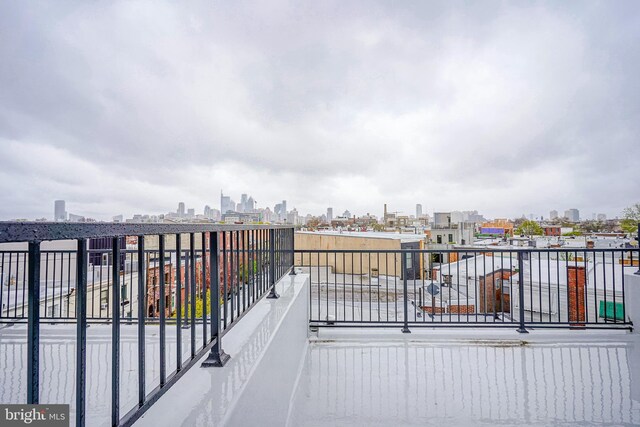 1143 Tasker St, Philadelphia, PA 19148 - view of patio featuring a view of city and a balcony