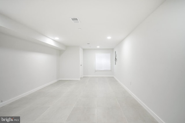 1143 Tasker St, Philadelphia, PA 19148 - below grade area with light tile patterned floors, baseboards, visible vents, and recessed lighting