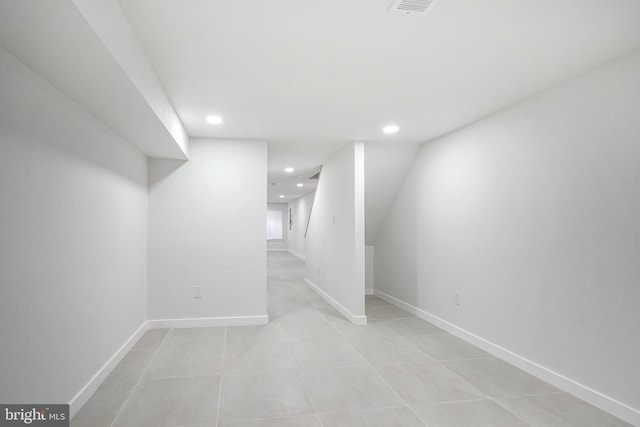 1143 Tasker St, Philadelphia, PA 19148 - finished below grade area with visible vents, baseboards, recessed lighting, and light tile patterned floors
