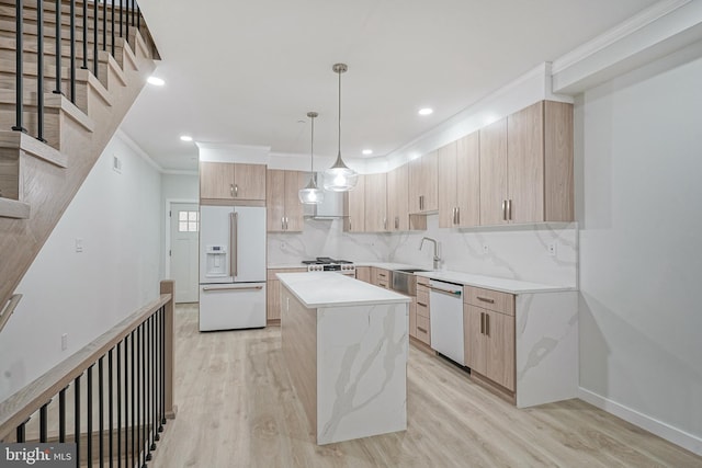 1143 Tasker St, Philadelphia, PA 19148 - kitchen featuring light brown cabinets, light wood finished floors, white appliances, and a kitchen island