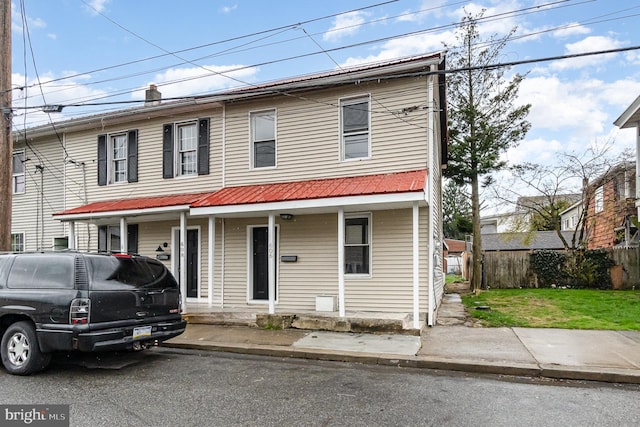 606 N St, Lykens, PA 17048 - view of front facade with fence and a porch