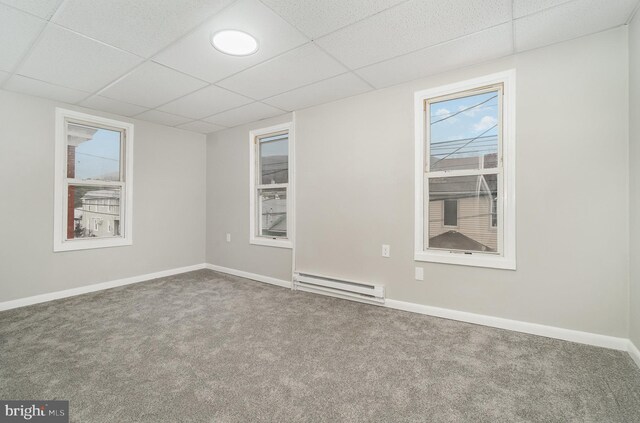 606 N St, Lykens, PA 17048 - carpeted spare room featuring a baseboard heating unit, a paneled ceiling, and baseboards