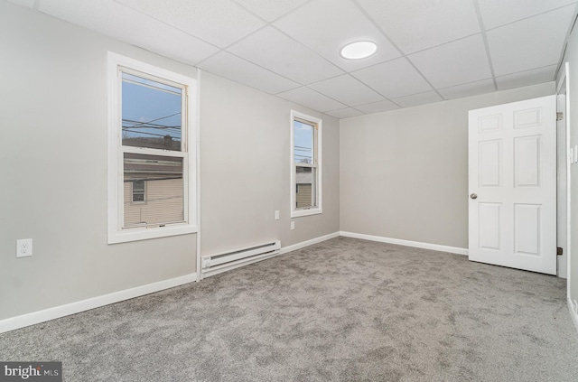 606 N St, Lykens, PA 17048 - carpeted empty room with baseboards, baseboard heating, and a paneled ceiling