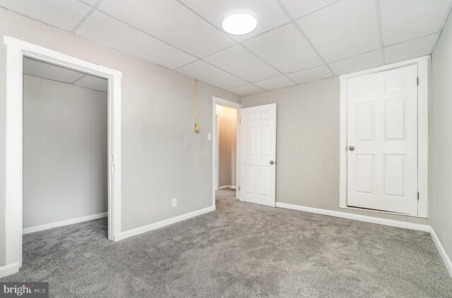 606 N St, Lykens, PA 17048 - unfurnished bedroom with baseboards, carpet flooring, and a paneled ceiling