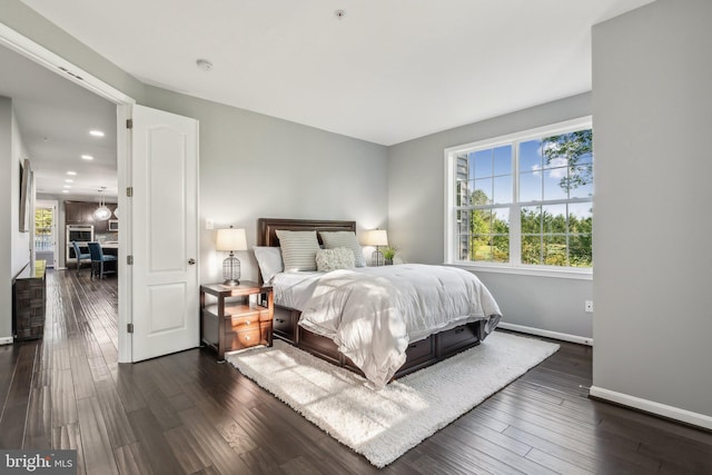 bedroom featuring dark wood-style flooring, recessed lighting, and baseboards