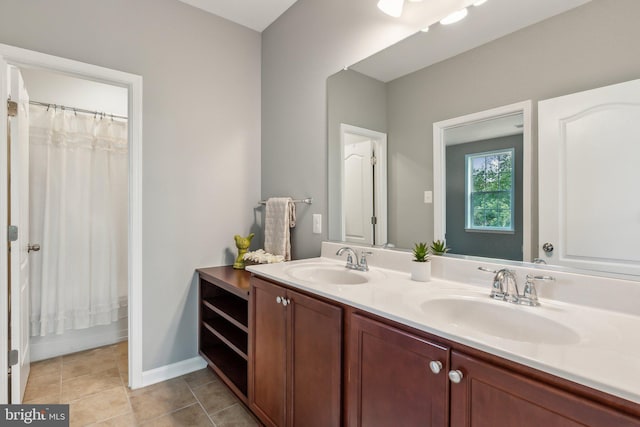 bathroom with double vanity, a sink, baseboards, and a shower with shower curtain
