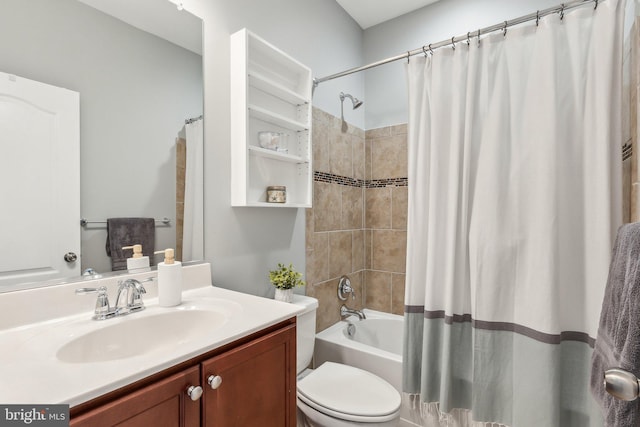 bathroom with shower / bath combo with shower curtain, toilet, and vanity