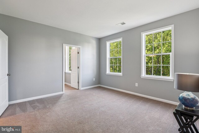 interior space featuring baseboards and visible vents