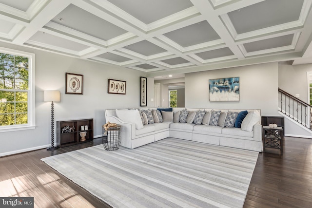 living area featuring baseboards, wood finished floors, stairway, and coffered ceiling