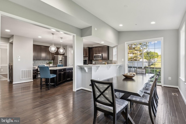 dining room featuring recessed lighting, baseboards, visible vents, and dark wood-style floors