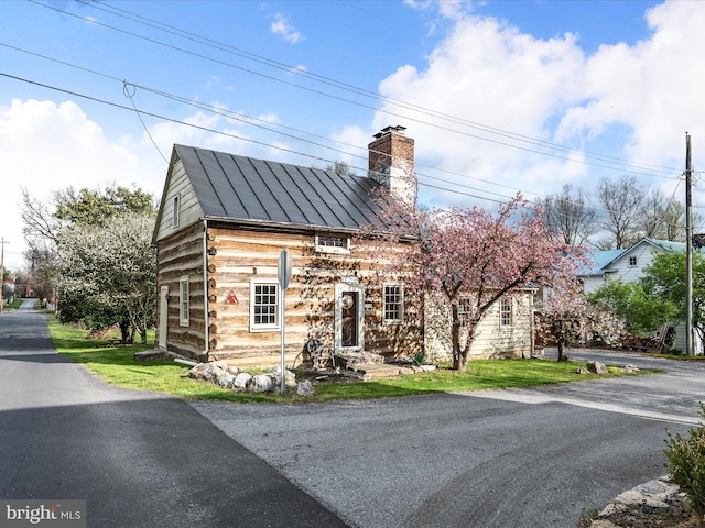 view of front of property with a chimney