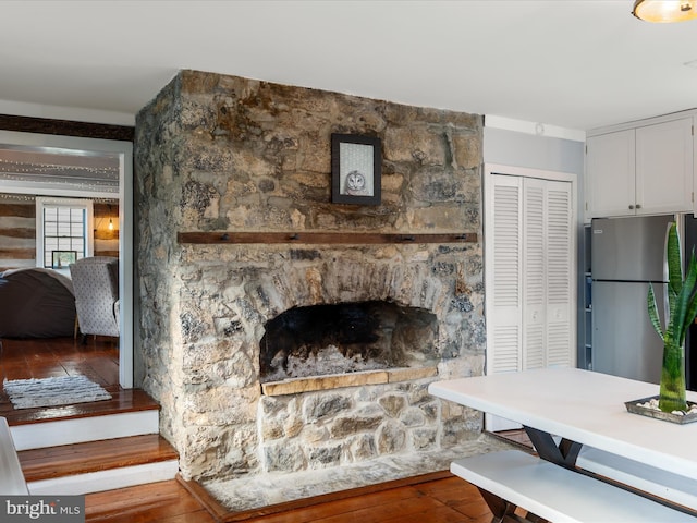 interior space featuring wood-type flooring and a fireplace