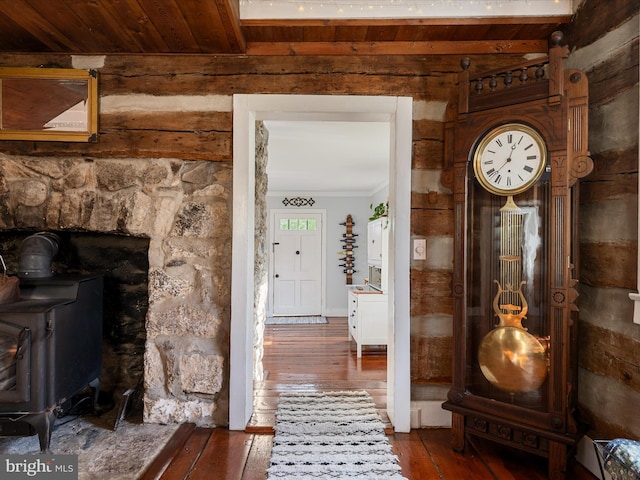 interior space with hardwood / wood-style floors, beam ceiling, and wooden ceiling