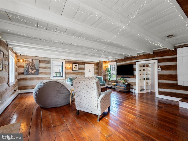 living room featuring wooden walls, a healthy amount of sunlight, hardwood / wood-style flooring, and wood ceiling