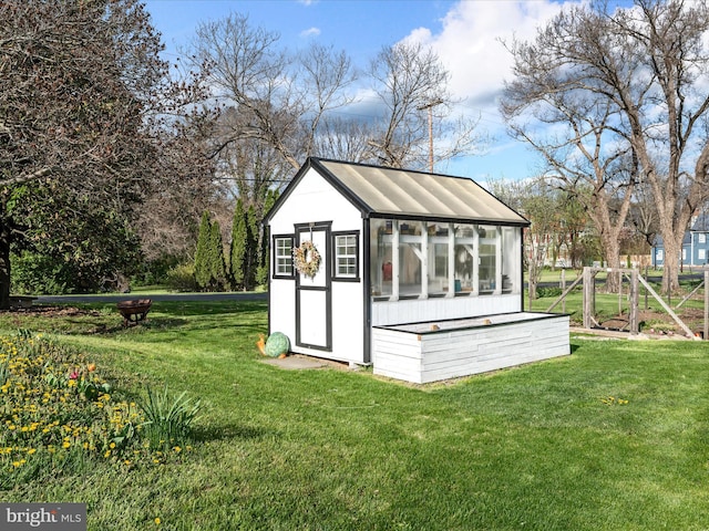 view of greenhouse with a yard