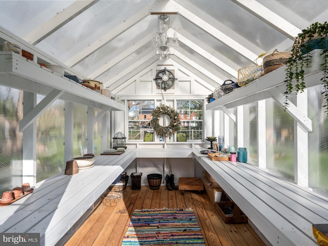 sunroom / solarium featuring beam ceiling