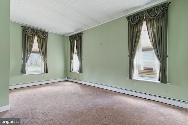 carpeted empty room with baseboards, plenty of natural light, and baseboard heating