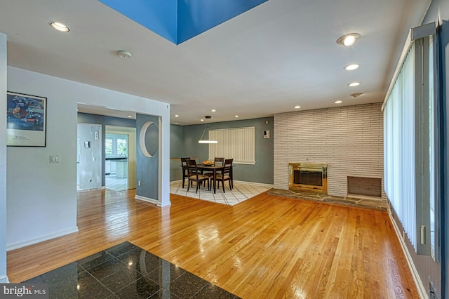 3820 Lorcom Ln, Arlington, VA 22207 - living area featuring recessed lighting, a large fireplace, baseboards, and granite finish floor