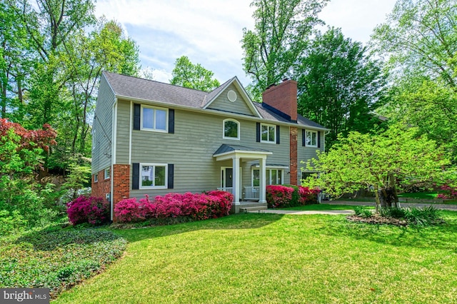 3820 Lorcom Ln, Arlington, VA 22207 - view of front facade with a chimney and a front yard