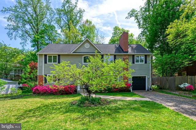 3820 Lorcom Ln, Arlington, VA 22207 - view of front facade featuring a garage, a chimney, driveway, fence, and a front yard