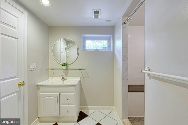 3820 Lorcom Ln, Arlington, VA 22207 - full bathroom with a tile shower, visible vents, baseboards, tile patterned flooring, and vanity