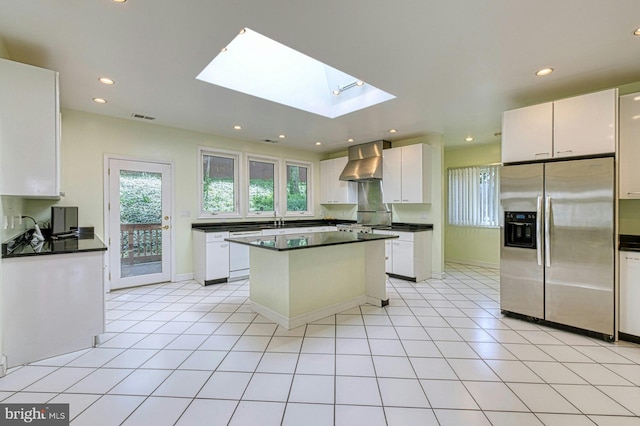 3820 Lorcom Ln, Arlington, VA 22207 - kitchen featuring wall chimney exhaust hood, dark countertops, visible vents, and stainless steel fridge with ice dispenser