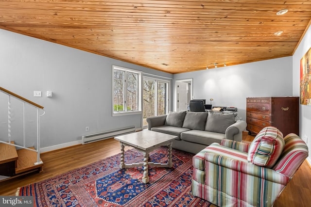 living area with baseboards, a baseboard heating unit, stairway, wooden ceiling, and wood finished floors