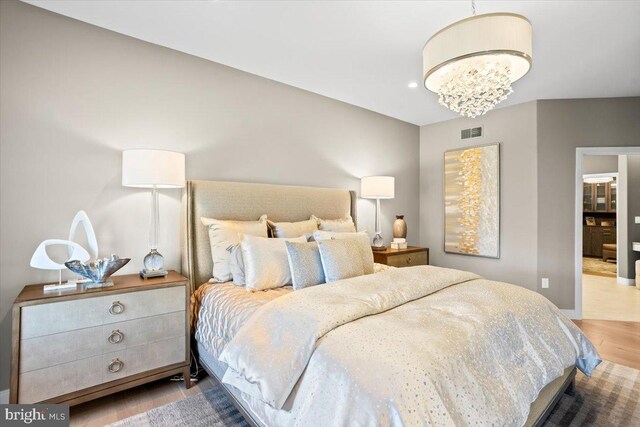 1205 Mosaic Dr, Lebanon, PA 17042 - bedroom with wood finished floors, a notable chandelier, visible vents, and recessed lighting