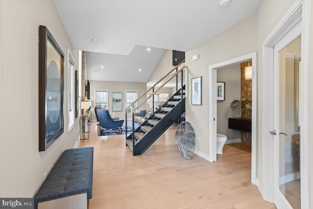 1205 Mosaic Dr, Lebanon, PA 17042 - interior space featuring baseboards, stairway, visible vents, lofted ceiling, and light wood finished floors