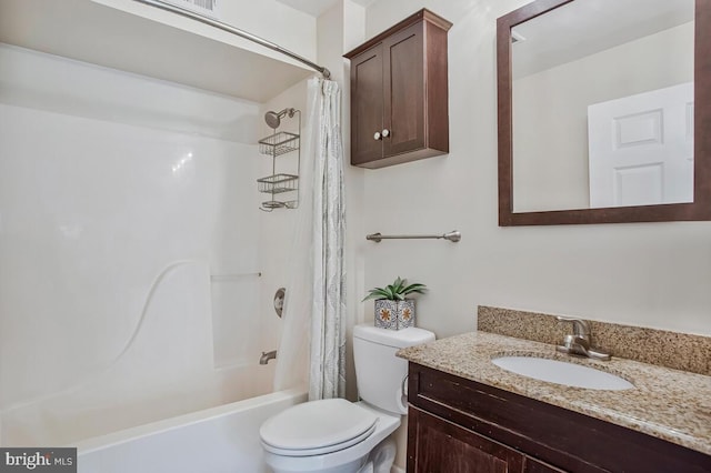 bathroom with vanity, toilet, and shower / tub combo