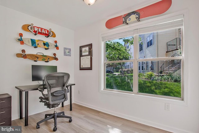 office space featuring wood finished floors and baseboards
