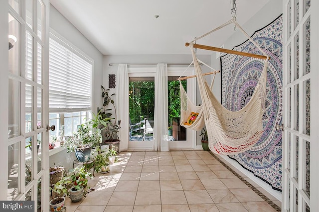 unfurnished sunroom featuring french doors