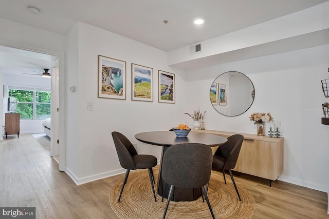 dining room with light wood-type flooring, baseboards, a ceiling fan, and recessed lighting