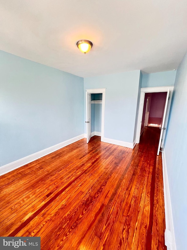 2328 W Lexington St, Baltimore, MD 21223 - interior space with baseboards and wood finished floors