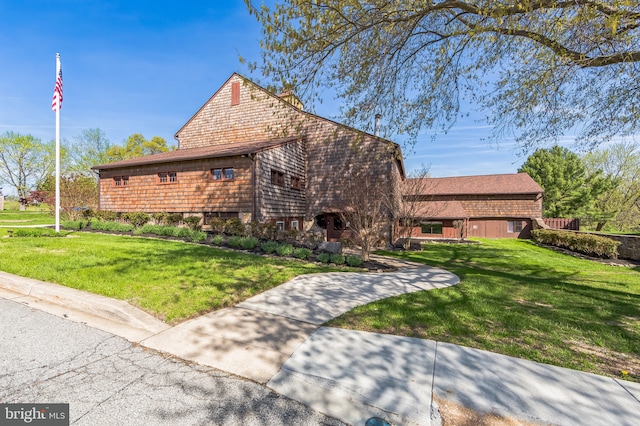 exterior space with a yard and a barn