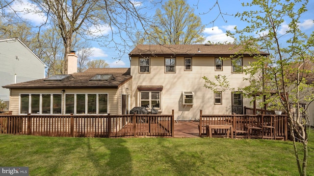 back of property with roof with shingles, a yard, a wall mounted air conditioner, and a chimney