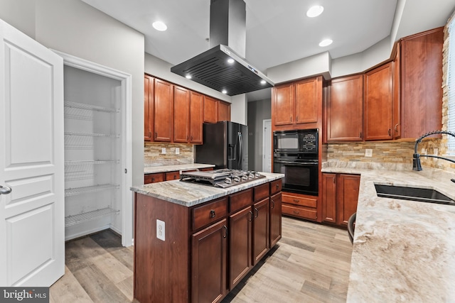 6319 Seton Ridge Dr, Baltimore, MD 21207 - kitchen featuring light wood finished floors, a sink, wall chimney exhaust hood, and black appliances