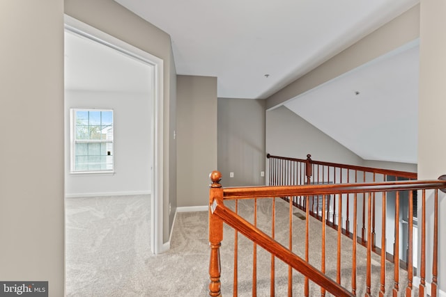 6319 Seton Ridge Dr, Baltimore, MD 21207 - hallway with carpet flooring, vaulted ceiling, an upstairs landing, and baseboards
