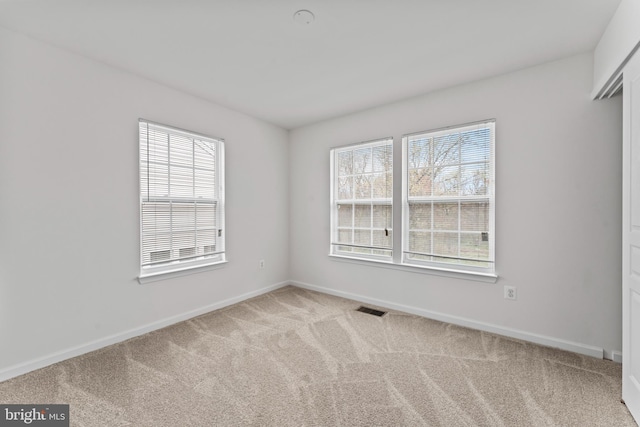 6319 Seton Ridge Dr, Baltimore, MD 21207 - carpeted spare room featuring visible vents, baseboards, and plenty of natural light