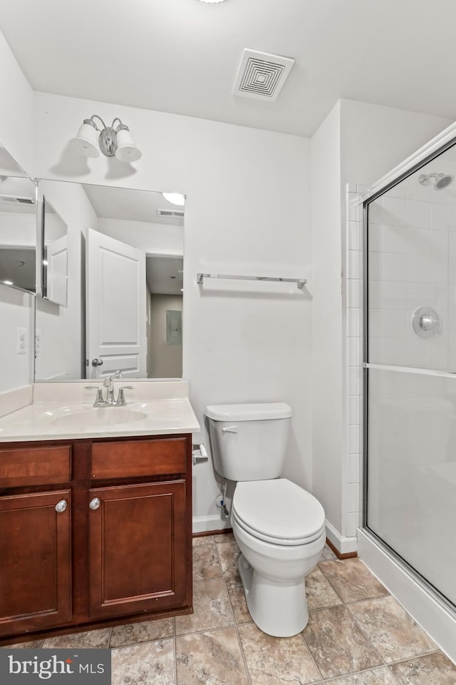 6319 Seton Ridge Dr, Baltimore, MD 21207 - bathroom featuring vanity, visible vents, toilet, a stall shower, and baseboards