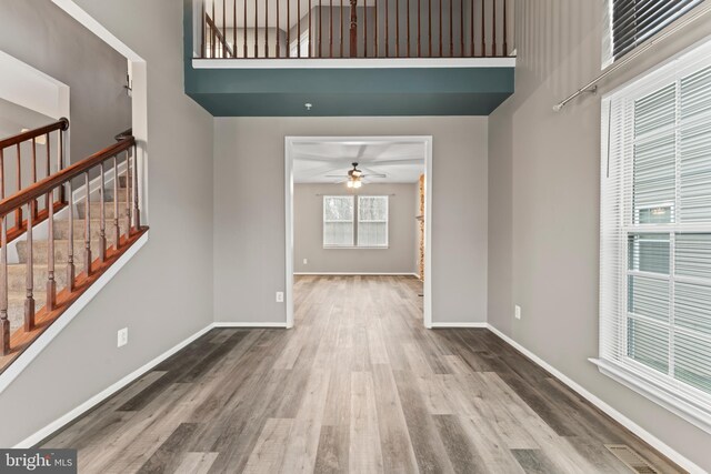 6319 Seton Ridge Dr, Baltimore, MD 21207 - interior space with wood finished floors, ceiling fan, baseboards, and stairway