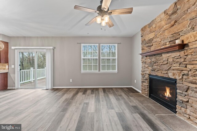 6319 Seton Ridge Dr, Baltimore, MD 21207 - unfurnished living room featuring ceiling fan, baseboards, wood finished floors, and a fireplace