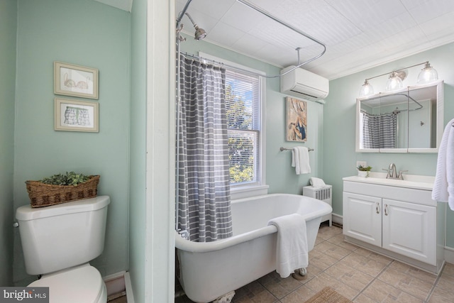 179 Green St, Annapolis, MD 21401 - full bathroom with a wall mounted AC, vanity, toilet, and a freestanding bath
