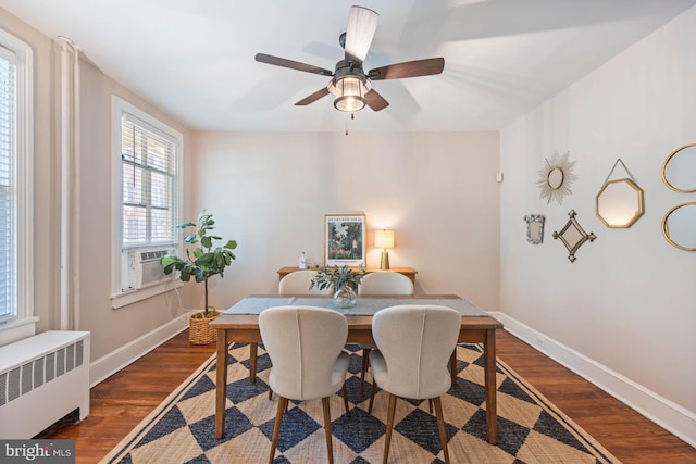 179 Green St, Annapolis, MD 21401 - dining area with radiator heating unit, baseboards, dark wood-style floors, a ceiling fan, and cooling unit